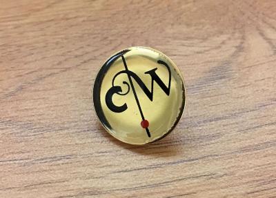 Three-Dimensional Objects depicts: "CW" is written on a gold pin in a very fanciful font, a black line with a red dot separates the C from the W