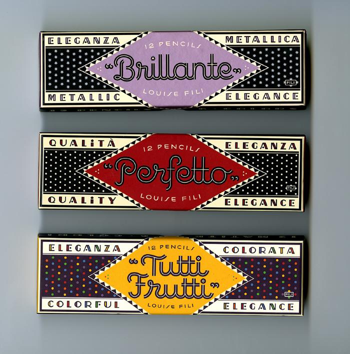 Three-Dimensional Objects, Packaging depicts: Three black boxes with polka dots. each box has a different colored diamond shaped label and product name, one with a purple "Brillante" one with a red "Perfetto" and one with a yellow "Tuttu-Frutti"