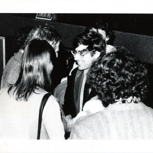 Photographic Materials depicts: blakc and black and white photograph of david shapiro speaking with members of the audience