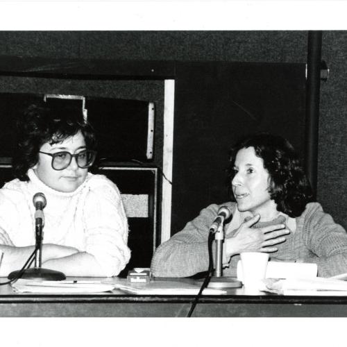 Photographic Materials depicts: black and white photograph of Ingrid Sischy (left) and Margia Kramer (right) sitting at table
