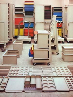 off-white modular storage units with a few units in red, yellow and blue.
