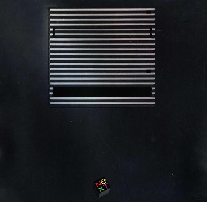 Research materials, Booklet/Brochure depicts: Black computer hard drive with square NEXT logo in colorful letters