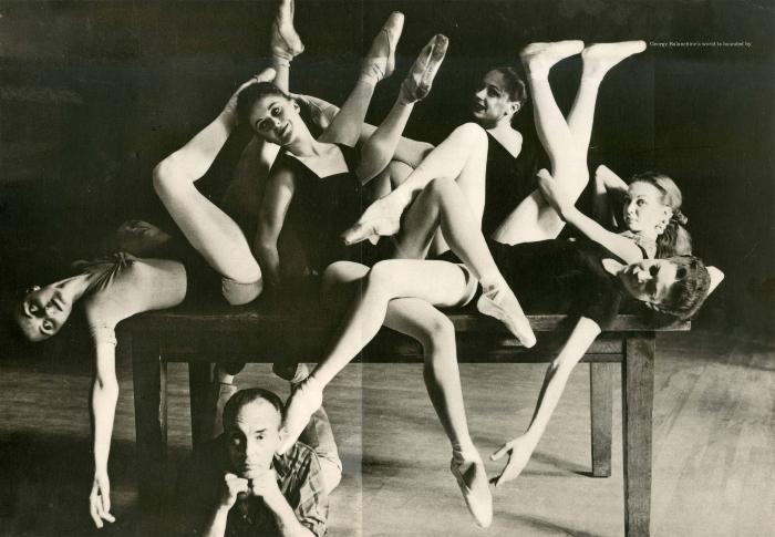 Serial Publications depicts: Black and white photo of a smiling man under a table with ballet dancers spread across it