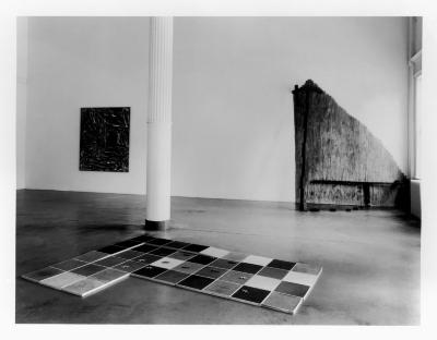 Photographic Materials depicts: black-and-white installation of artworks in a gallery