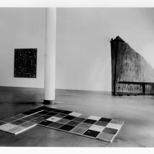 Photographic Materials depicts: black-and-white installation of artworks in a gallery