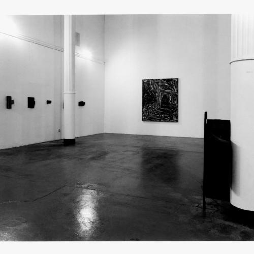 Photographic Materials depicts: black-and-white installation of artworks in a gallery