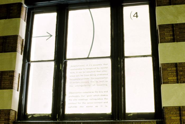 Photographic Materials depicts: color slides of artworks installed in a gallery, on windows