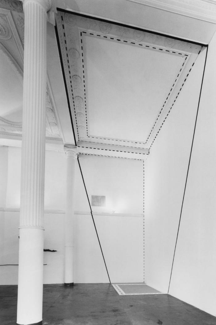 Photographic Materials depicts: black and white photographic print of artworks in a gallery