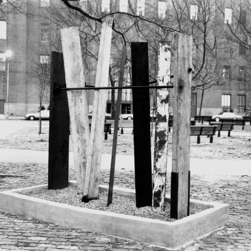 Photographic Materials depicts: black and white photographic print of artworks outside a gallery