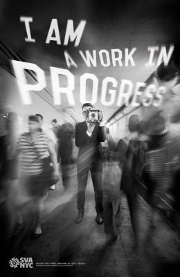 Posters depicts: Blurred black and white photograph of a man in a suit taking a picture of the viewer surrounded by a fast-moving crowd in the subway. Text appears above the crowd in white.